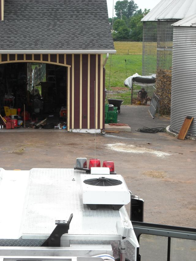 Firefighter Ross Greenwood feeding the chickens at Wismer's Farm